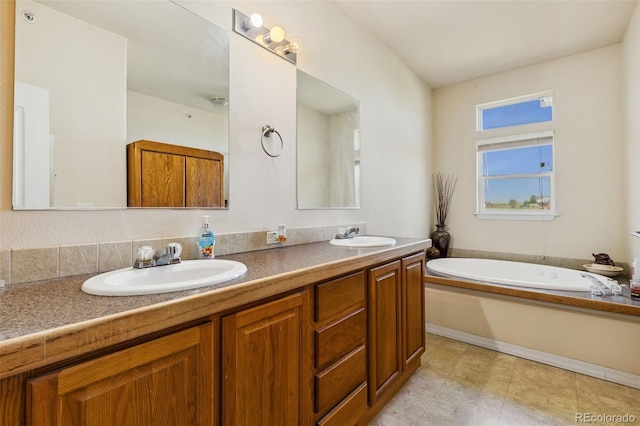 4241 Meadowlark Rd, Fort Lupton, CO 80621 - full bathroom featuring double vanity and a garden tub