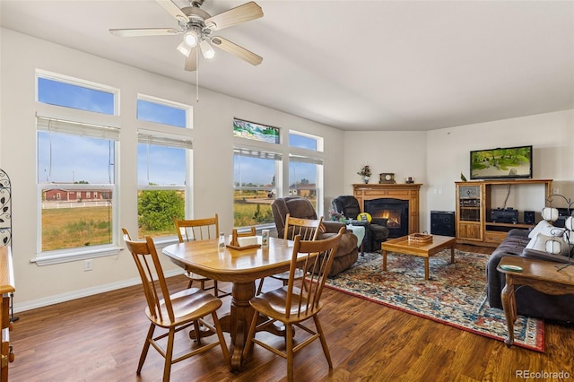4241 Meadowlark Rd, Fort Lupton, CO 80621 - dining room with wood finished floors, a glass covered fireplace, and ceiling fan