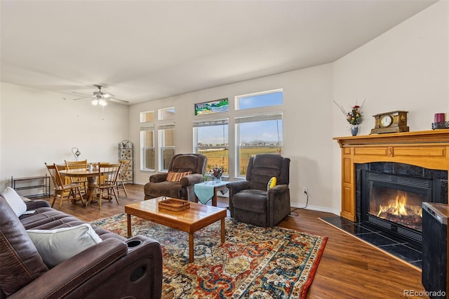 4241 Meadowlark Rd, Fort Lupton, CO 80621 - living room with ceiling fan, a fireplace, and dark wood-type flooring