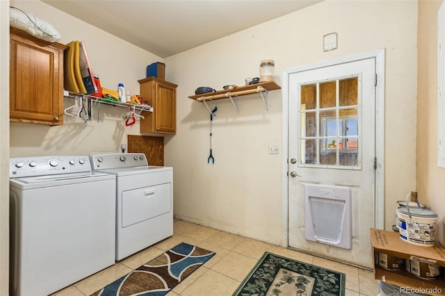 4241 Meadowlark Rd, Fort Lupton, CO 80621 - laundry area featuring washer and dryer, cabinet space, light tile patterned floors, and heating unit
