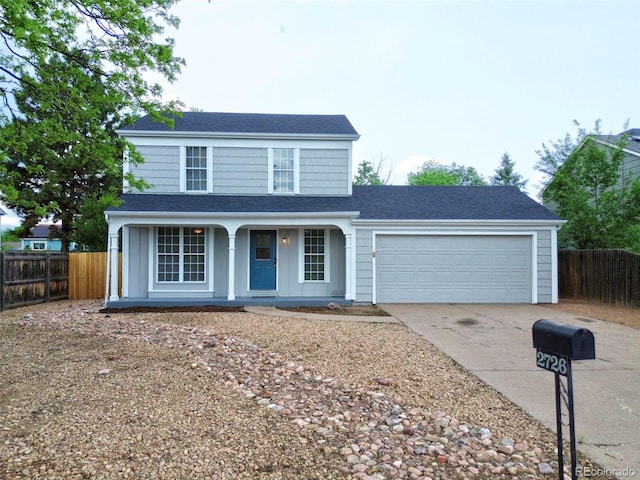 2726 Dickens Dr, Colorado Springs, CO 80916 - traditional-style home featuring concrete driveway, an attached garage, covered porch, and a shingled roof