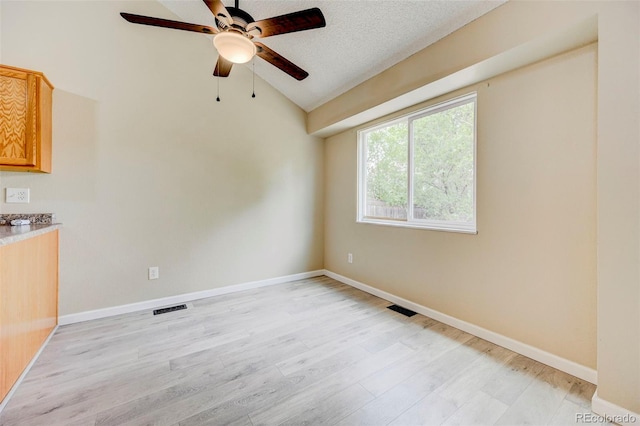 2726 Dickens Dr, Colorado Springs, CO 80916 - spare room with a ceiling fan, lofted ceiling, light wood-type flooring, and baseboards