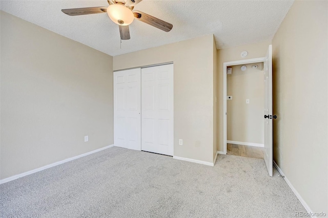 2726 Dickens Dr, Colorado Springs, CO 80916 - unfurnished bedroom featuring carpet, a textured ceiling, a closet, ceiling fan, and baseboards