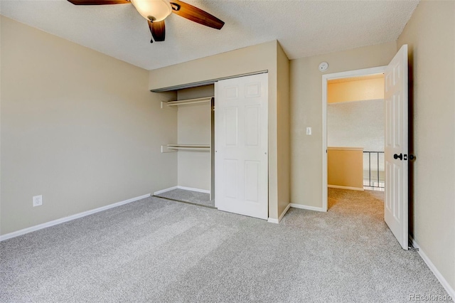 2726 Dickens Dr, Colorado Springs, CO 80916 - unfurnished bedroom with carpet flooring, a closet, a textured ceiling, baseboards, and a ceiling fan