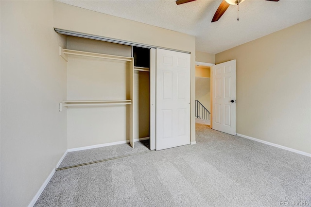 2726 Dickens Dr, Colorado Springs, CO 80916 - unfurnished bedroom with carpet, a closet, baseboards, a ceiling fan, and a textured ceiling