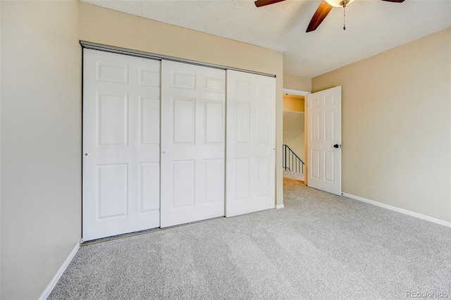 2726 Dickens Dr, Colorado Springs, CO 80916 - unfurnished bedroom with carpet flooring, baseboards, a closet, ceiling fan, and a textured ceiling