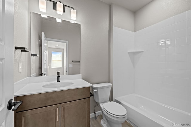 20871 E 60th Ave, Aurora, CO 80019 - full bathroom with vanity, toilet, washtub / shower combination, and a textured wall