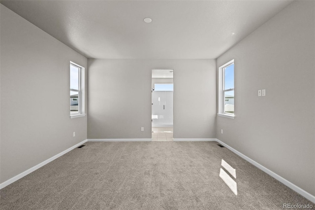 20871 E 60th Ave, Aurora, CO 80019 - carpeted spare room featuring baseboards