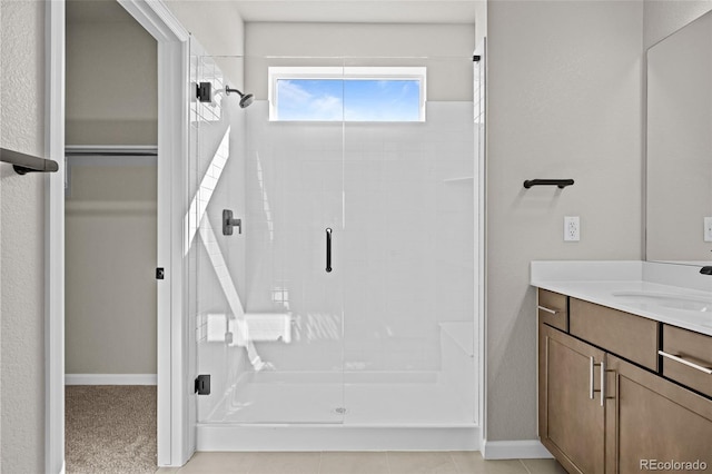20871 E 60th Ave, Aurora, CO 80019 - bathroom with a stall shower, vanity, and baseboards