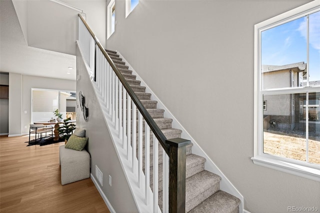 20871 E 60th Ave, Aurora, CO 80019 - stairs featuring wood finished floors and baseboards
