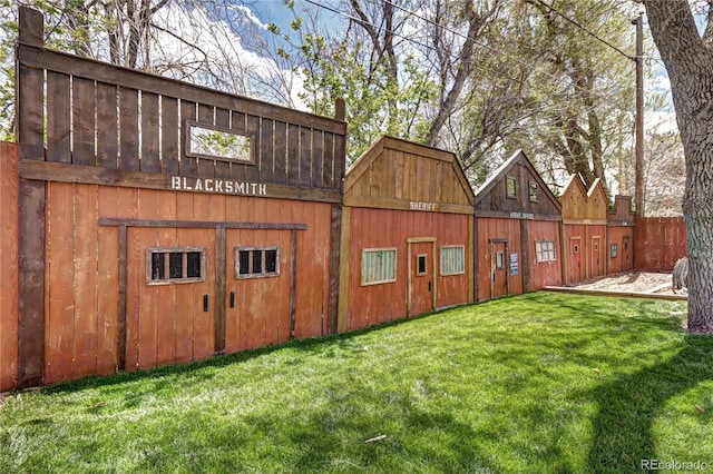 view of barn with a lawn