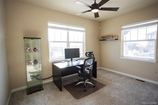 office featuring visible vents, baseboards, and a healthy amount of sunlight