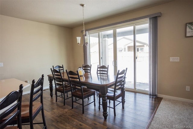 dining area featuring dark wood finished floors, baseboards, and a wealth of natural light