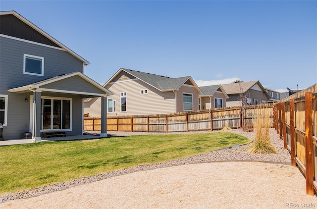 8073 Wheatland Dr, Colorado Springs, CO 80908 - view of yard with a fenced backyard, a patio area, and a residential view