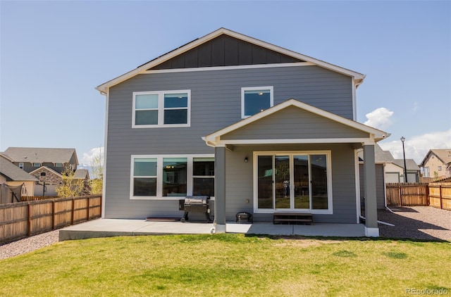 8073 Wheatland Dr, Colorado Springs, CO 80908 - back of house with a fenced backyard, a patio area, and a yard