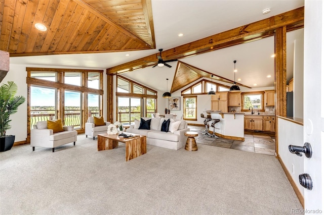 living area with light carpet, recessed lighting, a ceiling fan, and baseboards