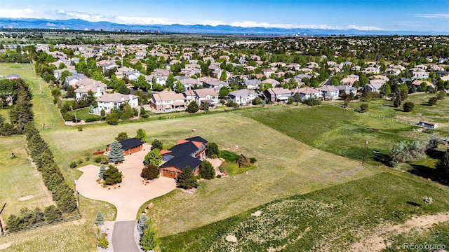 aerial view of residential area featuring a mountainous background