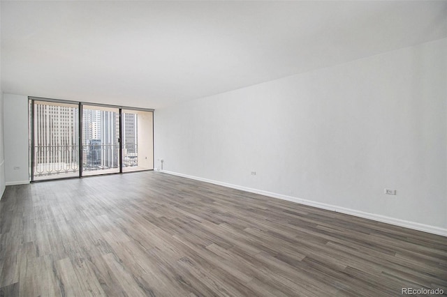 1020 15th St Unit 15G, Denver, CO 80202 - spare room with dark wood-style floors