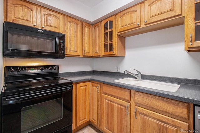 1020 15th St Unit 15G, Denver, CO 80202 - kitchen with black appliances, dark countertops, glass insert cabinets, and brown cabinetry
