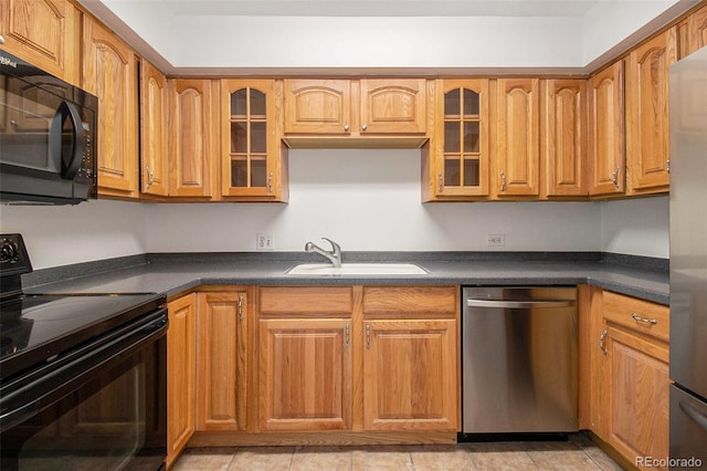 1020 15th St Unit 15G, Denver, CO 80202 - kitchen with black appliances, dark countertops, and glass insert cabinets