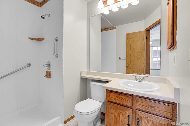 bathroom featuring a shower, vanity, and toilet