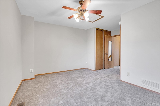 carpeted empty room with ceiling fan