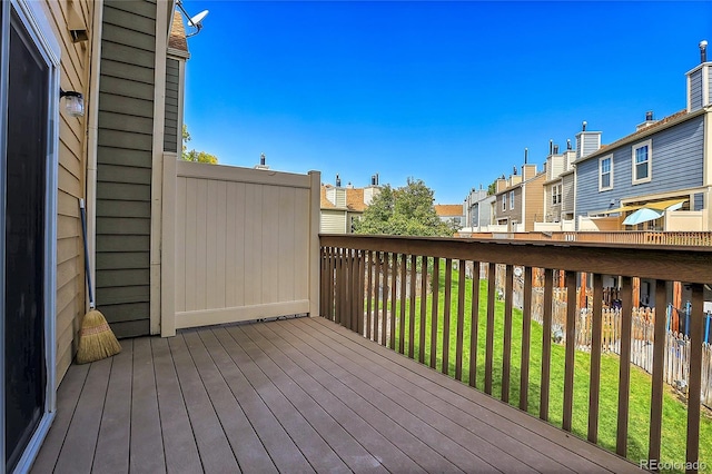 wooden terrace with a yard