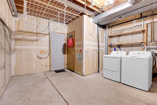 basement featuring washing machine and dryer