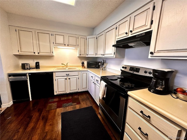 12565 Sheridan Blvd Unit 212, Broomfield, CO 80020 - kitchen featuring black appliances, under cabinet range hood, dark wood finished floors, light countertops, and a textured ceiling