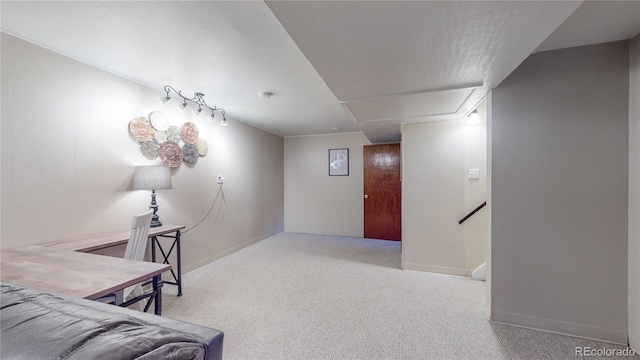 living area featuring carpet