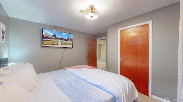 bedroom featuring carpet flooring