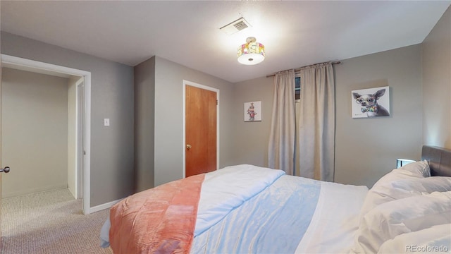 bedroom with visible vents, baseboards, and carpet floors
