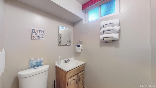 bathroom featuring toilet and vanity