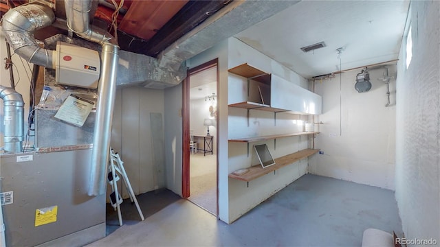 unfinished below grade area with visible vents and heating unit