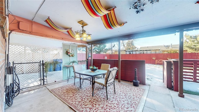 view of patio featuring outdoor dining area and fence