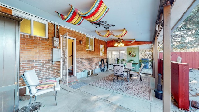 view of patio with outdoor dining area and fence