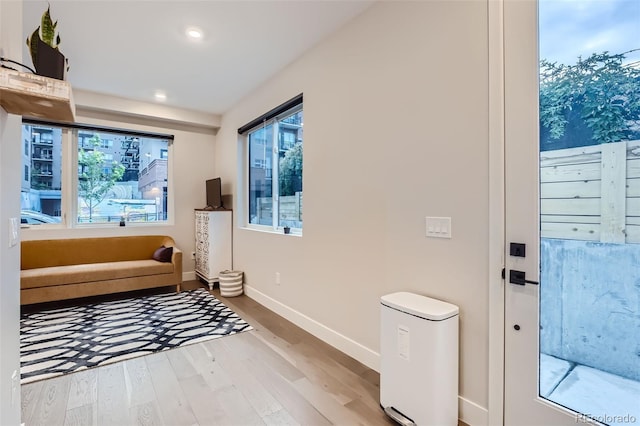 4025 Jason St Unit 101, Denver, CO 80211 - sitting room with wood finished floors, healthy amount of natural light, and recessed lighting