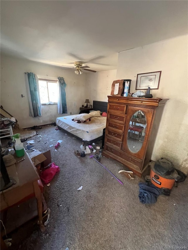 bedroom featuring ceiling fan and carpet