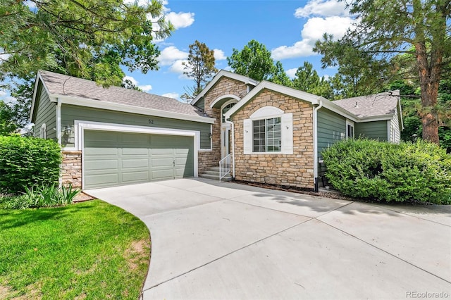 7400 W Grant Ranch Blvd Unit 52, Littleton, CO 80123 - ranch-style house with stone siding, a garage, driveway, and a shingled roof