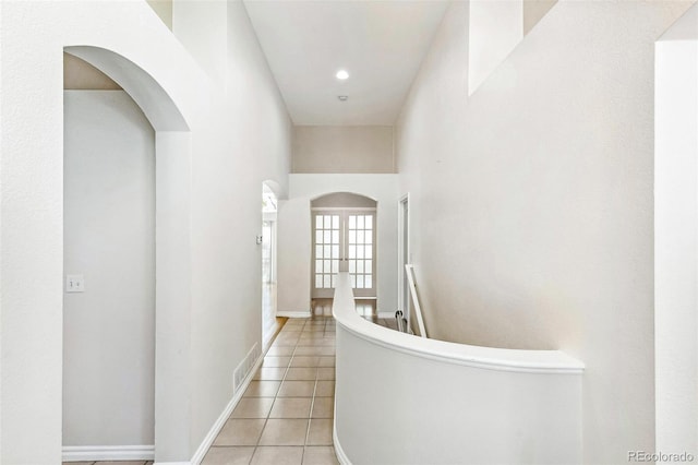 7400 W Grant Ranch Blvd Unit 52, Littleton, CO 80123 - hallway with arched walkways and light tile patterned floors