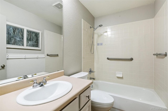 7400 W Grant Ranch Blvd Unit 52, Littleton, CO 80123 - bathroom featuring vanity, shower / tub combination, and a textured wall