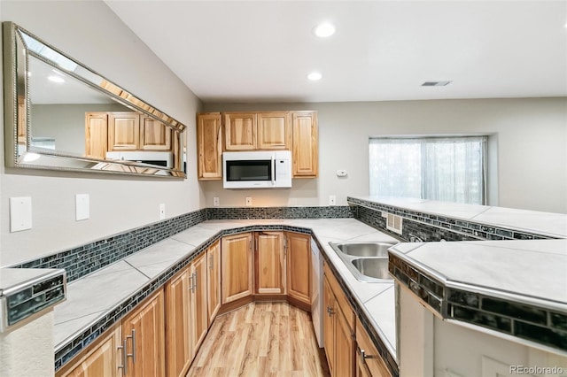 7400 W Grant Ranch Blvd Unit 52, Littleton, CO 80123 - kitchen featuring white microwave, light wood-style floors, recessed lighting, and dishwasher