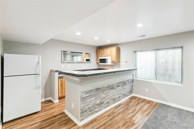 7400 W Grant Ranch Blvd Unit 52, Littleton, CO 80123 - kitchen with white appliances, light brown cabinetry, light wood-type flooring, and recessed lighting