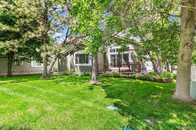 7400 W Grant Ranch Blvd Unit 52, Littleton, CO 80123 - view of green lawn featuring a wooden deck