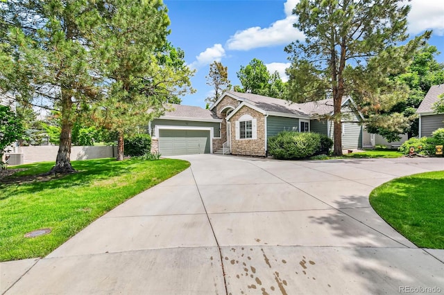7400 W Grant Ranch Blvd Unit 52, Littleton, CO 80123 - ranch-style home with concrete driveway, stone siding, a garage, and a front lawn