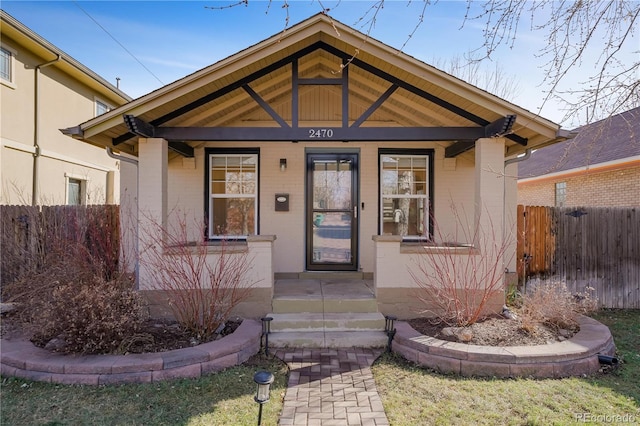 view of exterior entry featuring a porch