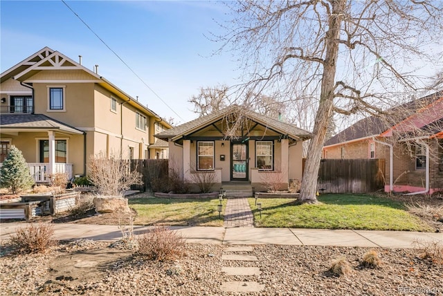 view of front of house featuring a front yard and covered porch