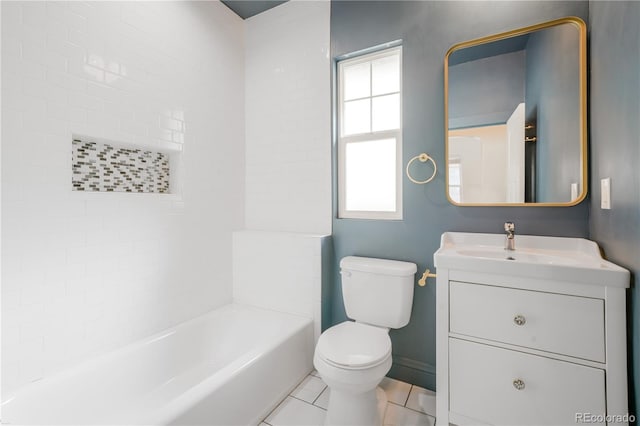 full bathroom featuring vanity, tiled shower / bath, tile patterned flooring, and toilet