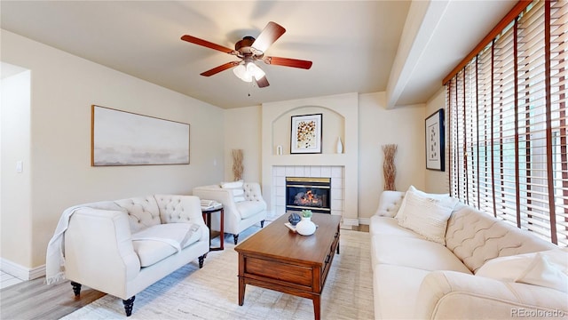 11301 Vernon Way, Parker, CO 80134 - living area with ceiling fan, light wood-type flooring, baseboards, and a tile fireplace