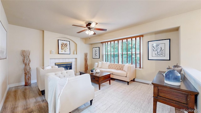 11301 Vernon Way, Parker, CO 80134 - living room featuring a ceiling fan, baseboards, a fireplace, and wood finished floors